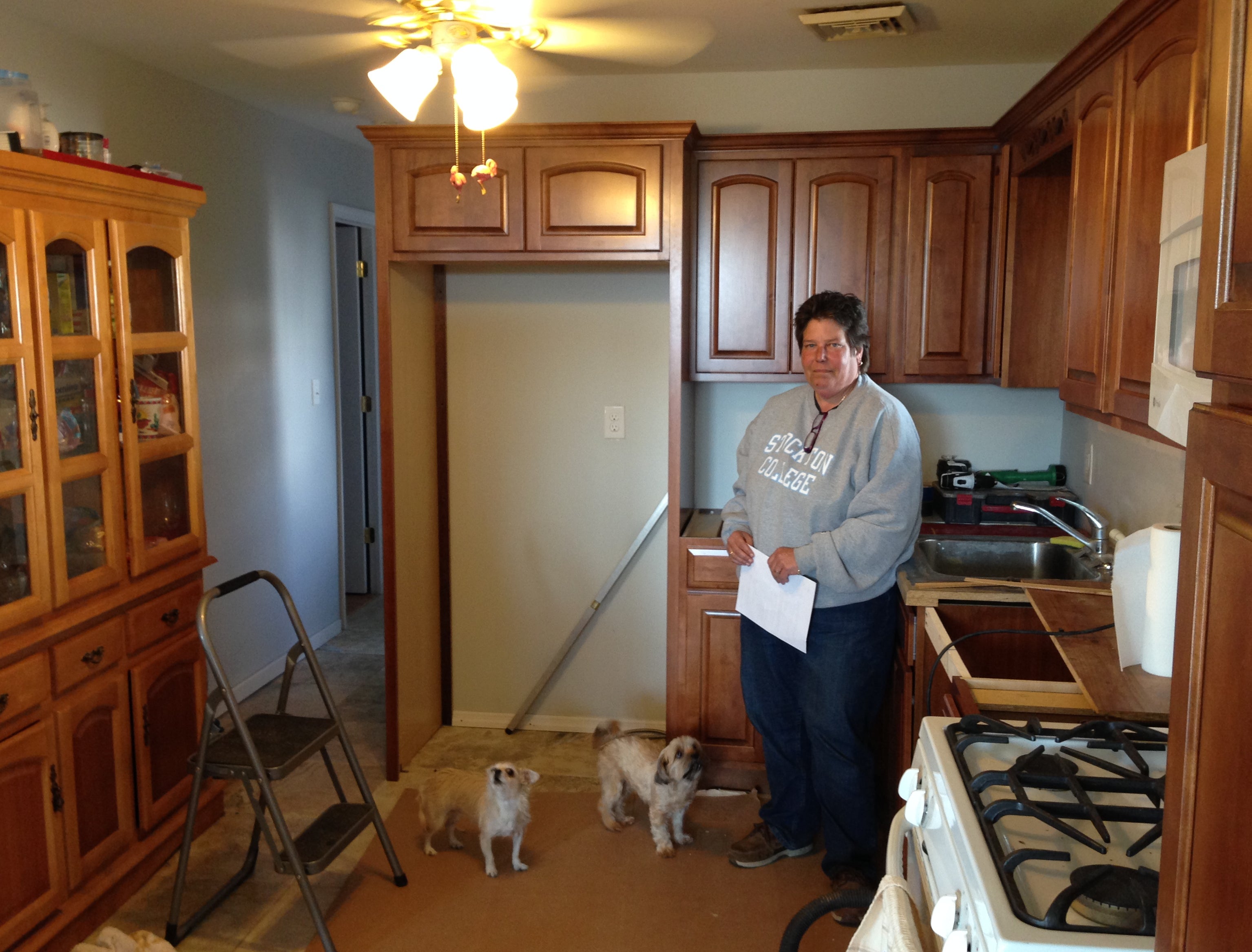  Lisa Stevens in her renovated kitchen, which was damaged during Sandy. (Tracey Samuelson/for NewsWorks) 