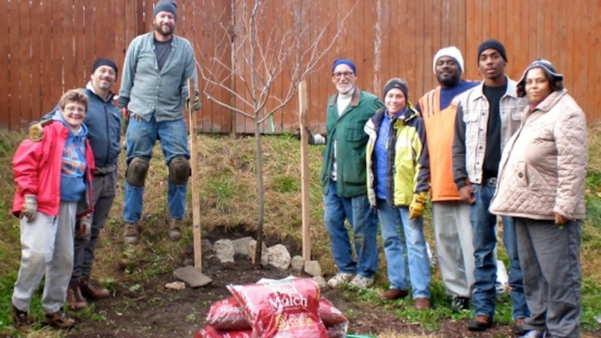  Volunteers plants a tree in fall 2013. (Courtesy of Doris Kessler) 