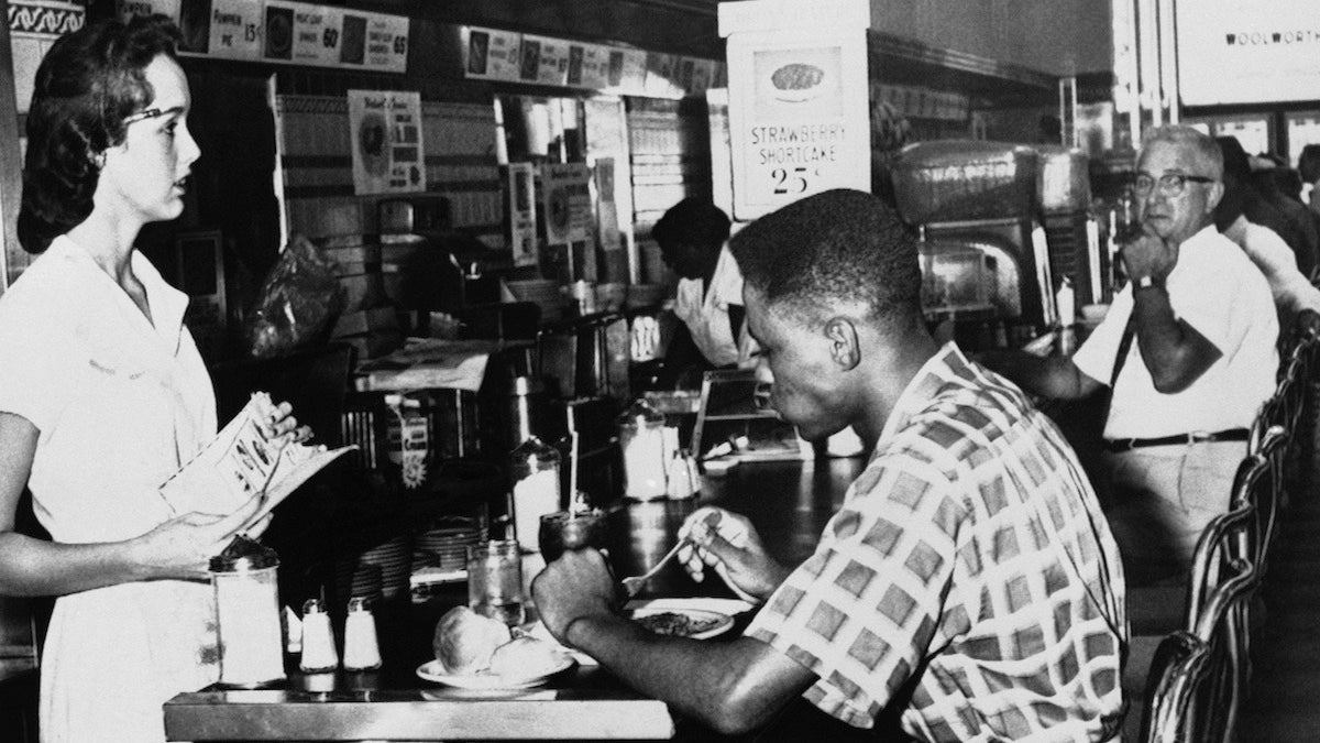  A Black man desegregates a lunch counter in Tampa on Sept. 14, 1960.  (AP Photo) 