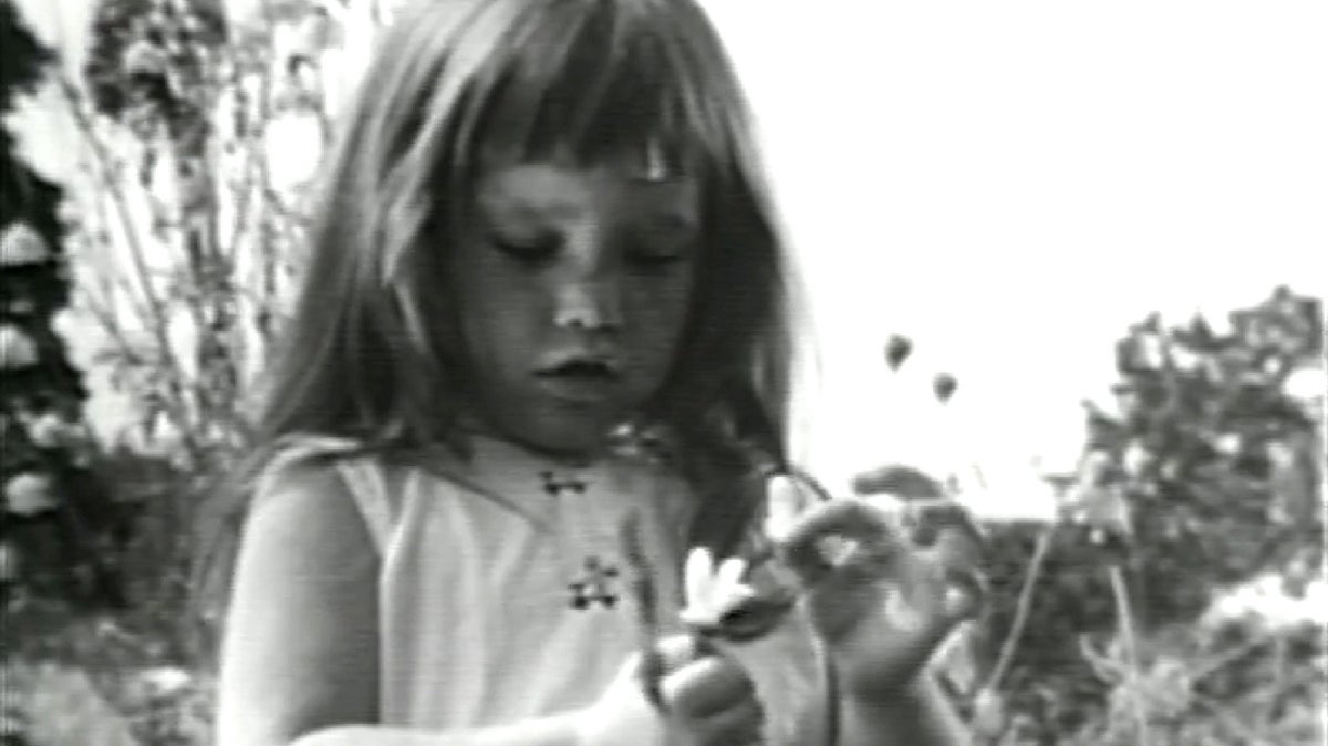 This image made from video made available by the Democratic National Committee via the LBJ Library shows a girl plucking petals from a flower in a 1964 presidential campaign television commercial titled 
