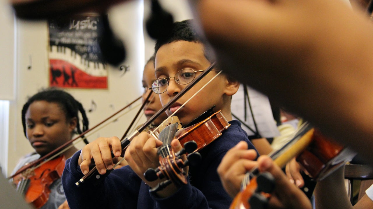  Matthew Tarekegan, a fifth grader at St. Francis de Salles, rehearses with the Play On, Philly! orchestra. The students are learning a remix of West Side Story Mambo composed by high school students. (Emma Lee/for NewsWorks) 