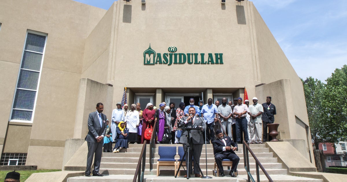  Leaders and members of the Masjidullah congregation gather to share a message of love Friday afternoon. (Kimberly Paynter/WHYY) 