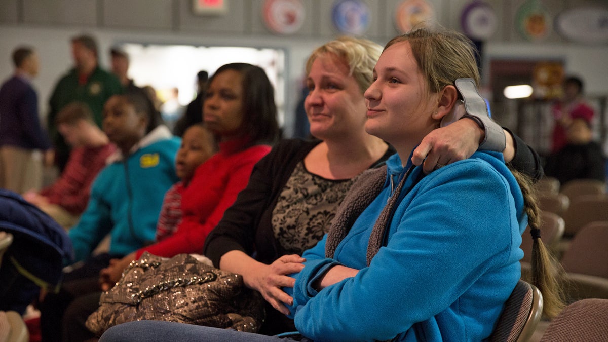  Anastasia Ratkova (center) becomes emotional as her daughter, Nicole, 14, is named first on the 9th grade waiting list at MaST Community Charter School.  (Lindsay Lazarski/WHYY)  