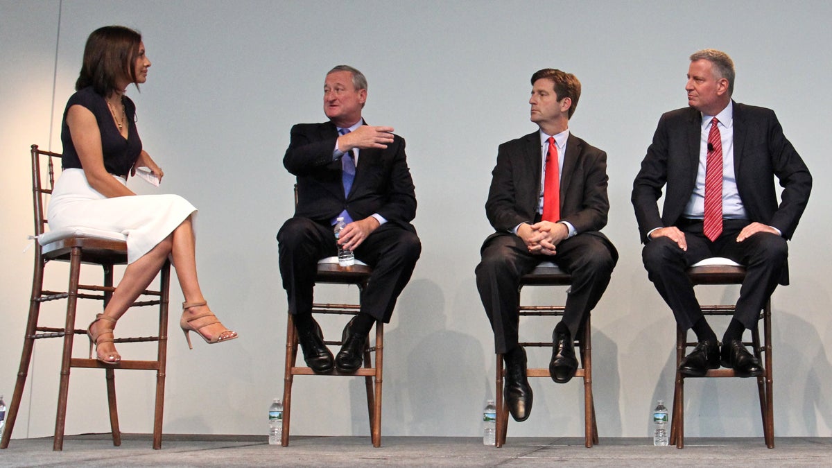 President of Voto Latino Maria Teresa Kumar (left) moderates a discussion on immigration and federal policy with (from left) Philadelphia Mayor Jim Kenney