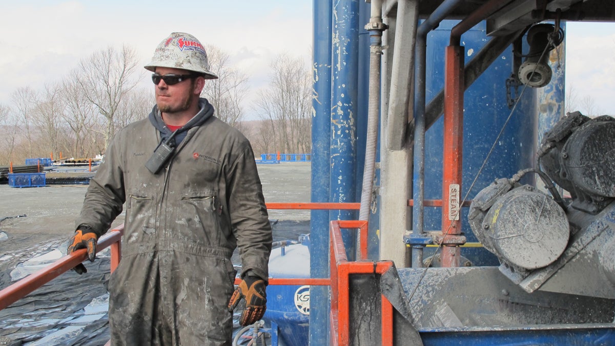  A worker stands by a natural gas well in Susquehanna County, Pennsylvania. (Susan Phillips/StateImpact Pennsylvania) 