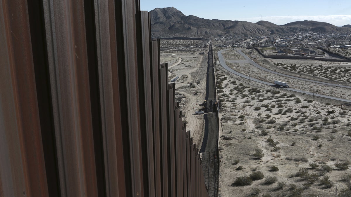 A truck drives near the Mexico-U.S. border fence. Sens. John McCain and Chris. Coons formally introduced a bill that would grant permanent legal status to undocumented immigrants known as “Dreamers,” and start bolstering security along the U.S.-Mexico border. (AP file photo)