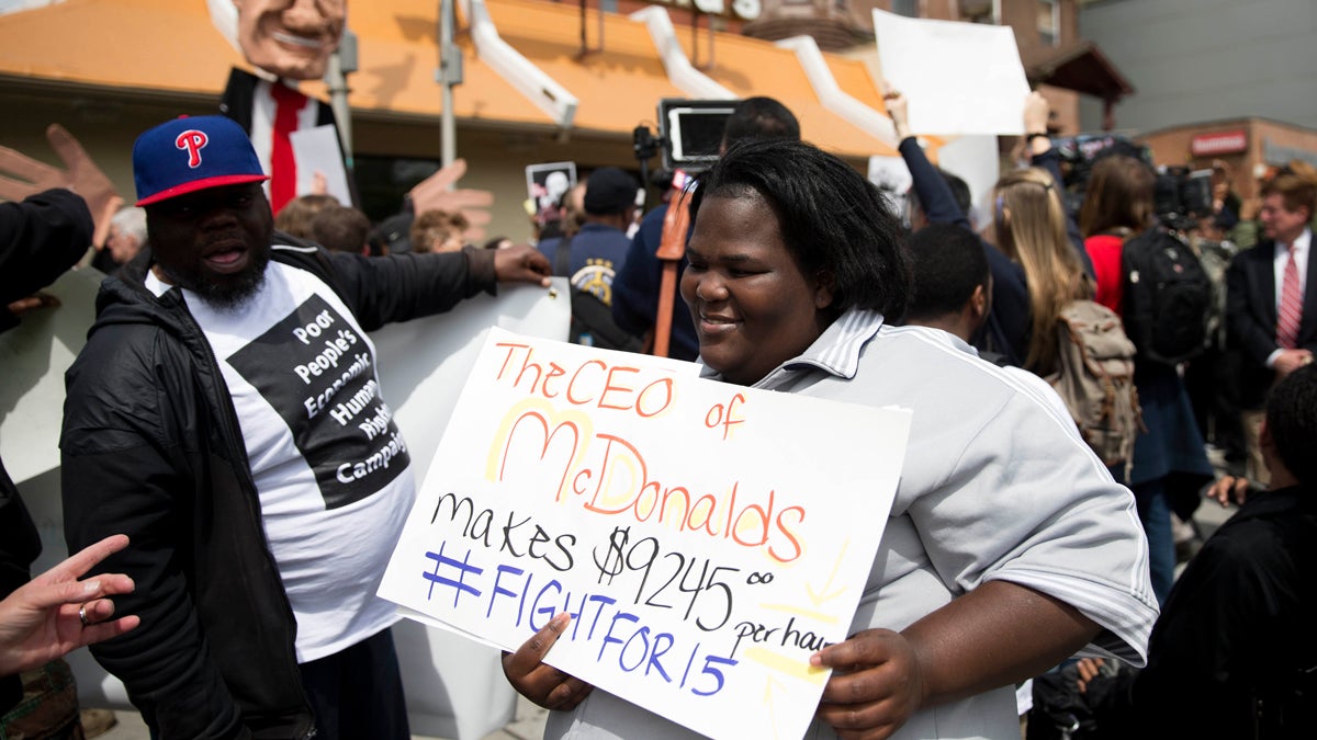  Fast food worker Lateefa Davis gathers with others for a May Day demonstration calling for a raise of the minimum wages to $15 an hour Friday, May 1, 2015, at a McDonald's restaurant in Philadelphia, Pa. (AP Photo/Matt Rourke) 