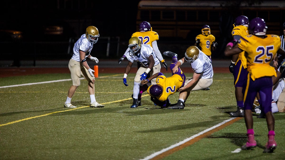 MLK quarterback Nasir Boykin scores one of his two touchdowns in a 55-26 loss to the Salesianum Sallies