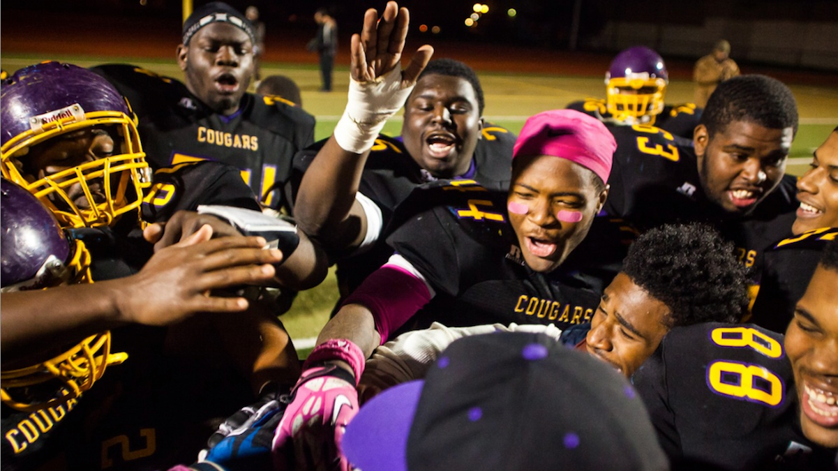  The MLK High Cougars football team celebrates its win over Franklin. (Brad Larrison/for NewsWorks) 