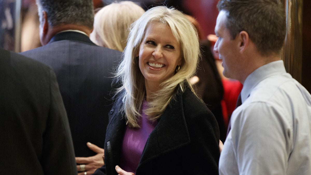 Monica Crowley smiles as she exits the elevator in the lobby of Trump Tower in New York