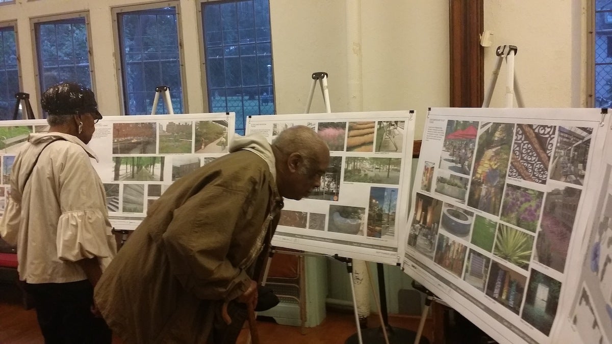  Residents check out the design proposals for the looming Maplewood Mall revamp project. (Queen Muse/for NewsWorks) 