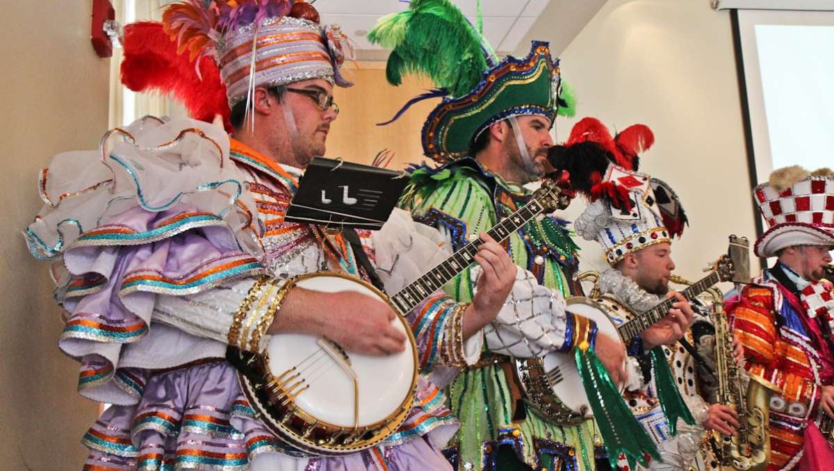  A Mummers band swings at a press conference to announce a new Fancy Brigade troupe Friday afternoon. (Kimberly Paynter/WHYY) 