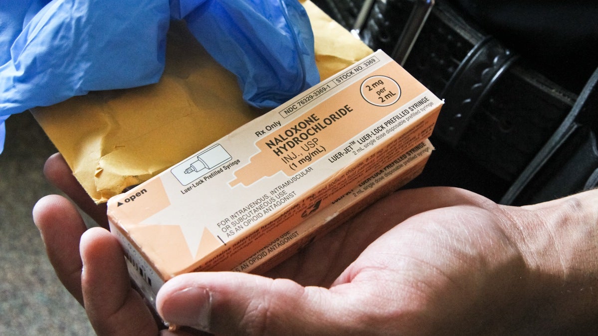  Police officers in Camden County are now issued a manila envelope with the drug Narcan at the beginning of their shifts. Officers also receive nasal sprayers to administer the drug and rubber gloves. (Kimberly Paynter/WHYY) 