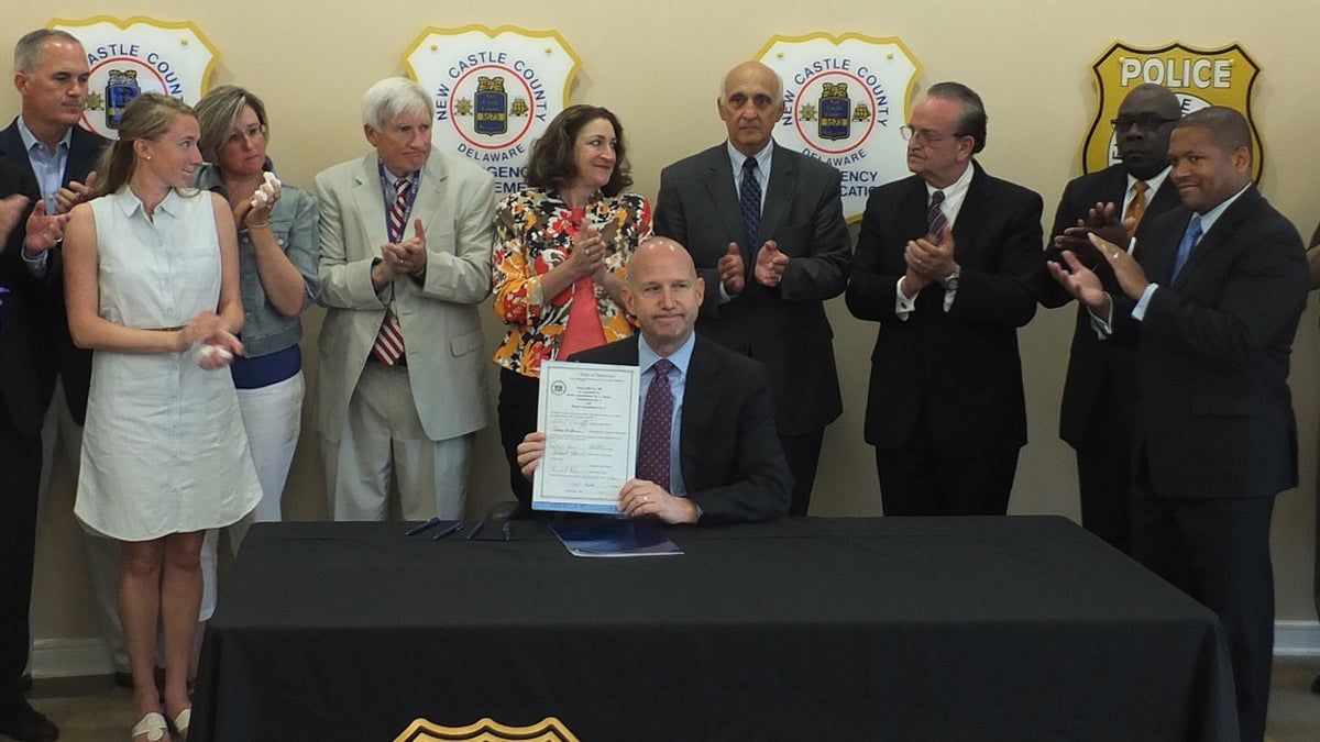  Joined by state, county, and nonprofit leaders, Gov. Jack Markell  signed House Bill 388, which allows peace officers who have completed a Delaware Health and Social Services-approved training course to receive, carry, and administer the drug naloxone. (Image courtesy of the governor's office.) 