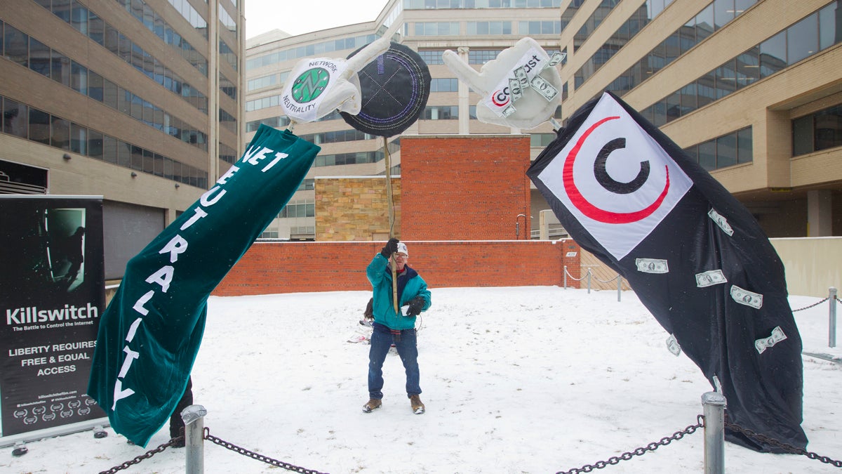  Rob Thorp, a member of Backbone Campaign, demonstrates outside the Federal Communication Commission (FCC) in Washington, Thursday, Feb. 26, 2015. (AP Photo/Pablo Martinez Monsivais) 