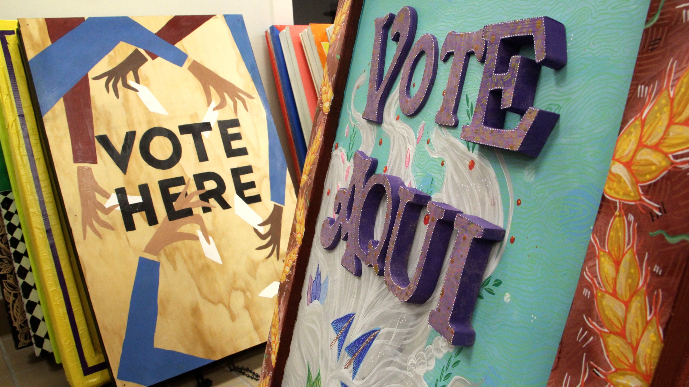 Sixty signs were made by local artists as part of the Next Stop, Democracy project, funded by the Knight Foundation, aimed at improving voter turnout. (Emma Lee/WHYY)