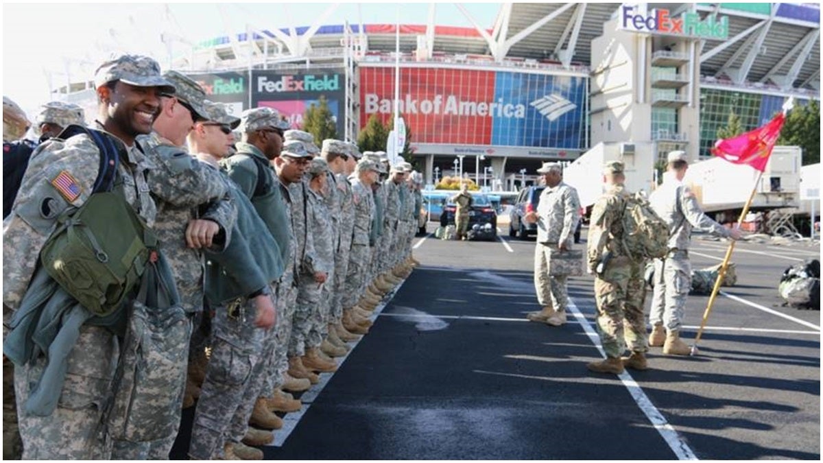 Soldiers with the Delaware Army National Guard's 262nd Component Repair Company appear outside of FedEx Field in Landover