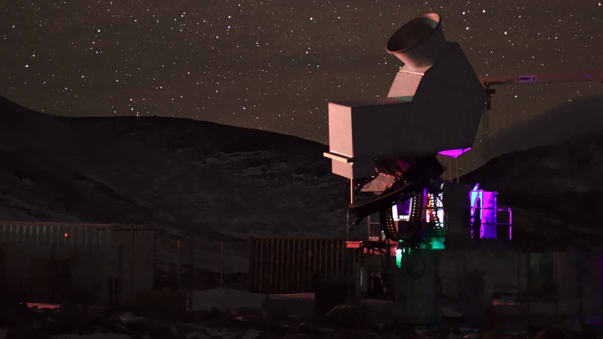 A photo of the first CLASS telescope observing the sky at night in the Atacama Desert in Chile. (Courtesy of Johns Hopkins University)