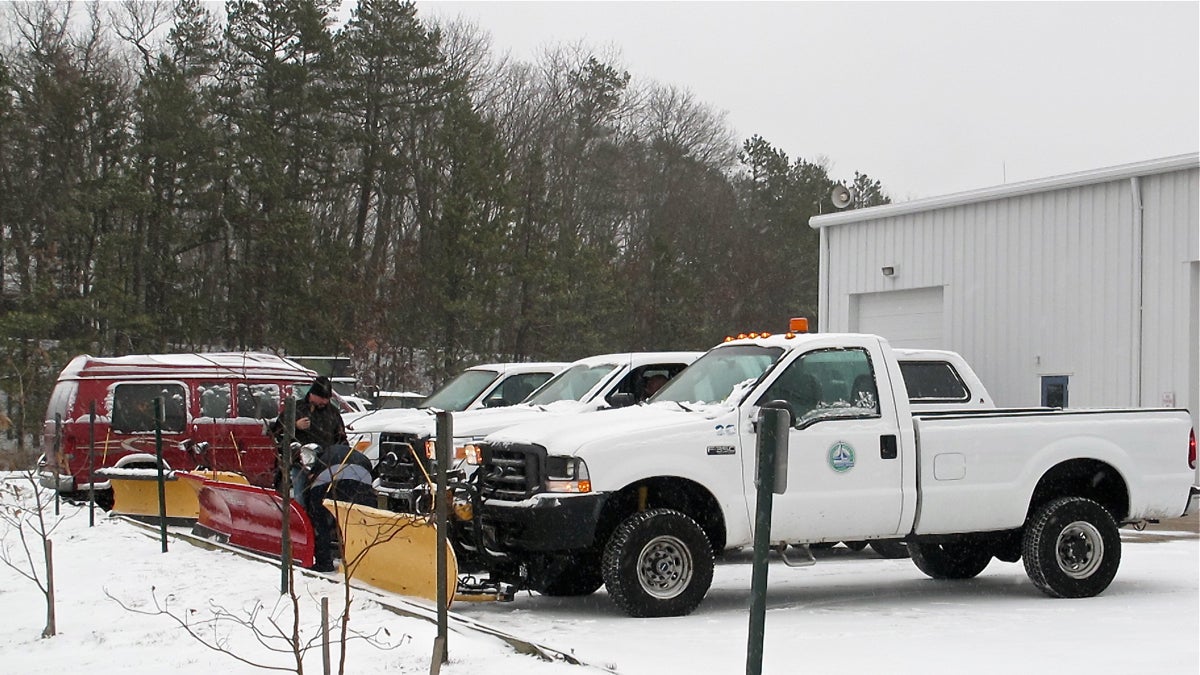  Brick Township, N.J., Public Works employees check snow removal equipment as a winter storm bears down on the state. (Phil Gregory/WHYY) 