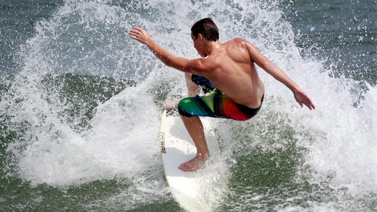  A surfers is shown doing a spin-trick in Manasquan, N.J. (AP Photo/Mel Evans, file) 