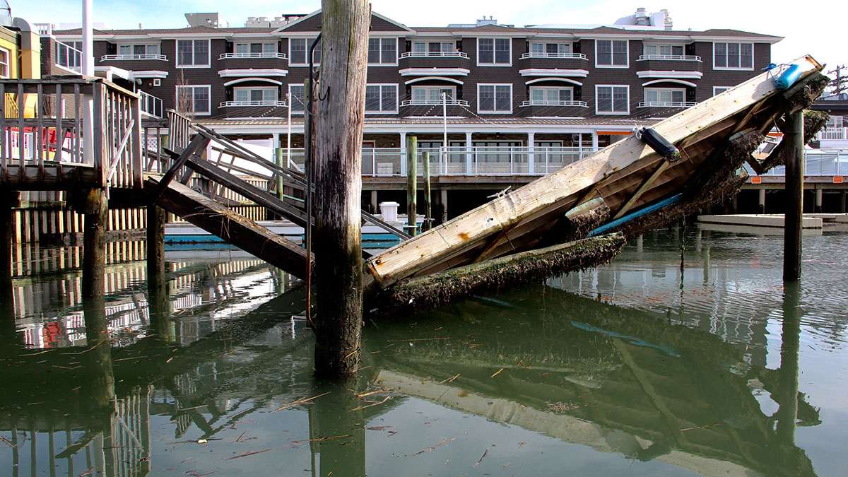  The violence of the storm is reflected in the now glassy water of the back bay in Stone Harbor. (Emma Lee/WHYY) 