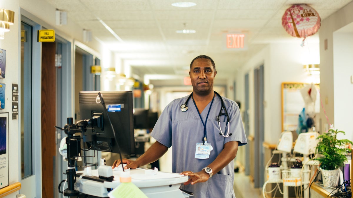 Registered nurse Elikana Njeri came to the U.S. from Kenya in 2002 and planned to become an accountant. Today he works at Penn State Hershey Medical Center in Central Pennsylvania.(Dani Fresh/for WHYY)