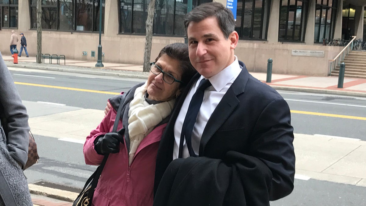  Senator Larry Farnese smiles with his mother outside the Federal Courthouse in Philadelphia after an acquittal  exonerating him of charges (Bobby Allyn/WHYY) 