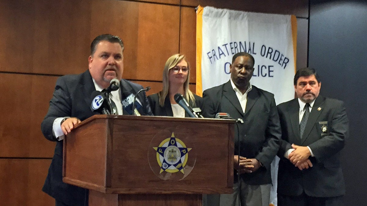  Fraternal Order of Police President John McNesby and state Rep. Martina White say police officers who are involved in shootings deserve privacy.  (Bobby Allyn/WHYY) 