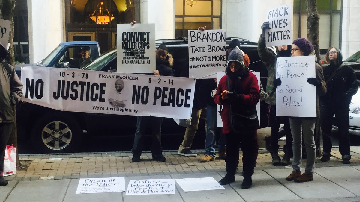  Protesters in January calling for more answers in the fatal December shooting of Brandon Tate-Brown. The group assembled outside of an event in which U.S. Attorney General Eric Holder met with city leaders for a roundtable about community relations with police. (Bobby Allyn/WHYY) 