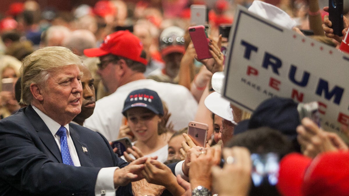 Republican Nominee for President Donald Trump shook supporters hands after a campaign speech in Bucks County Friday at the Newtown Athletic Club. (Brad Larrison for NewsWorks)