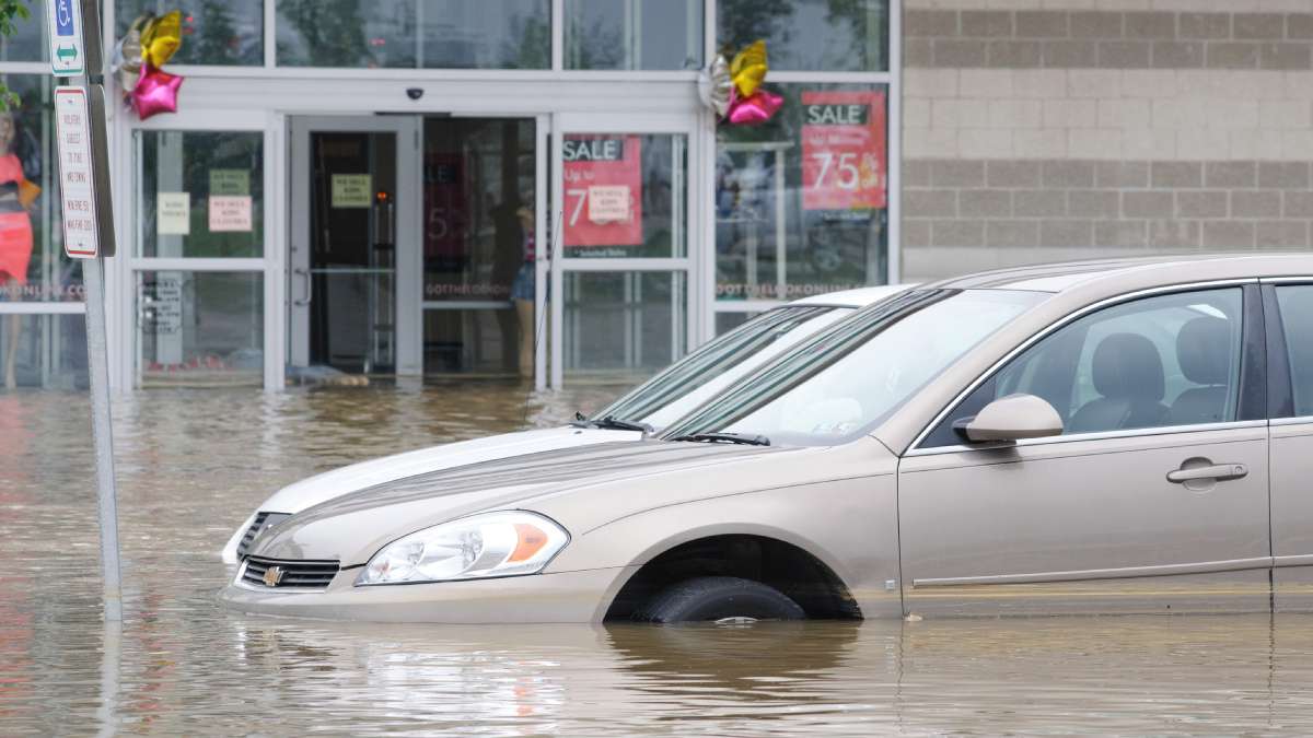  Multiple cars in the Bakers Centre parking lot were partially submerged following the  June 18 water main break in East Falls. (Bastiaan Slabbers/for NewsWorks) 