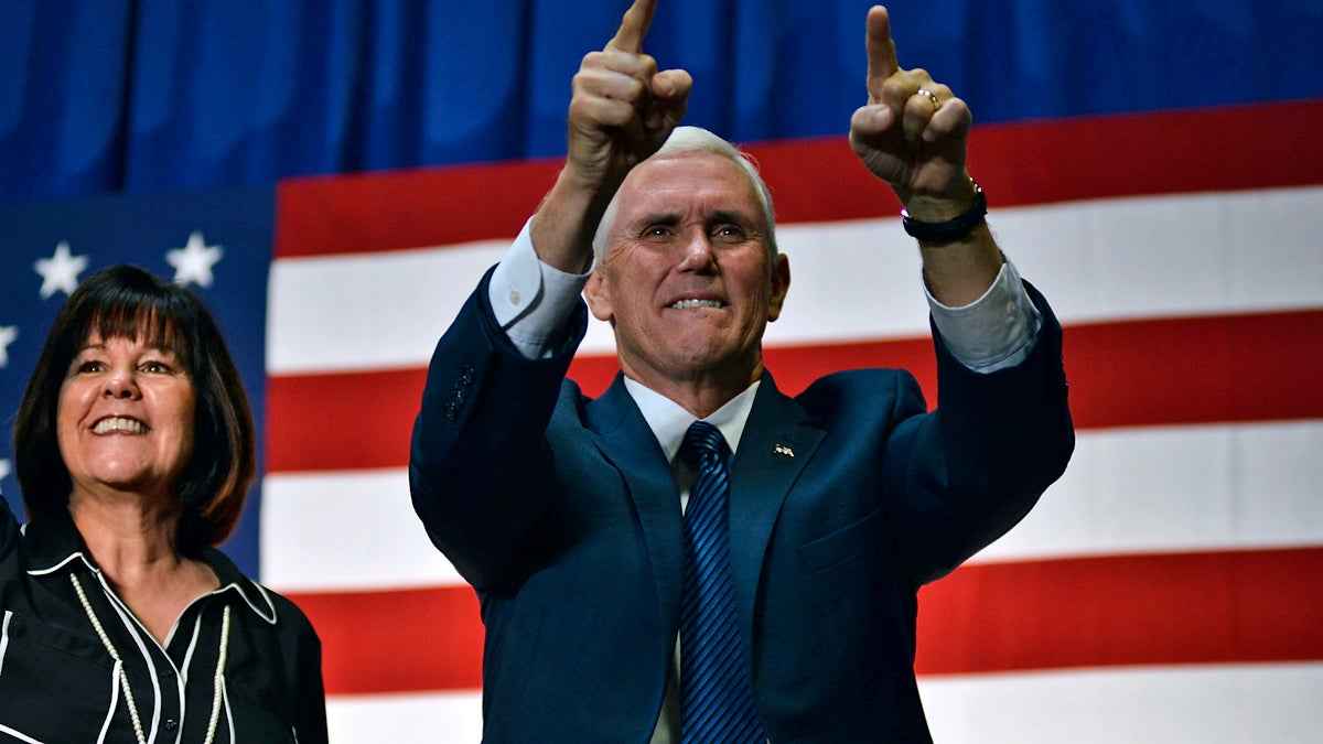 Mike Pence, Vice-presidential candidate for the Republican Party, accompanied by his wife Karen Pence greet voters as the take the stage at a rally in the Philadelphia suburbs, on Friday. (Bastiaan Slabbers for NewsWorks)