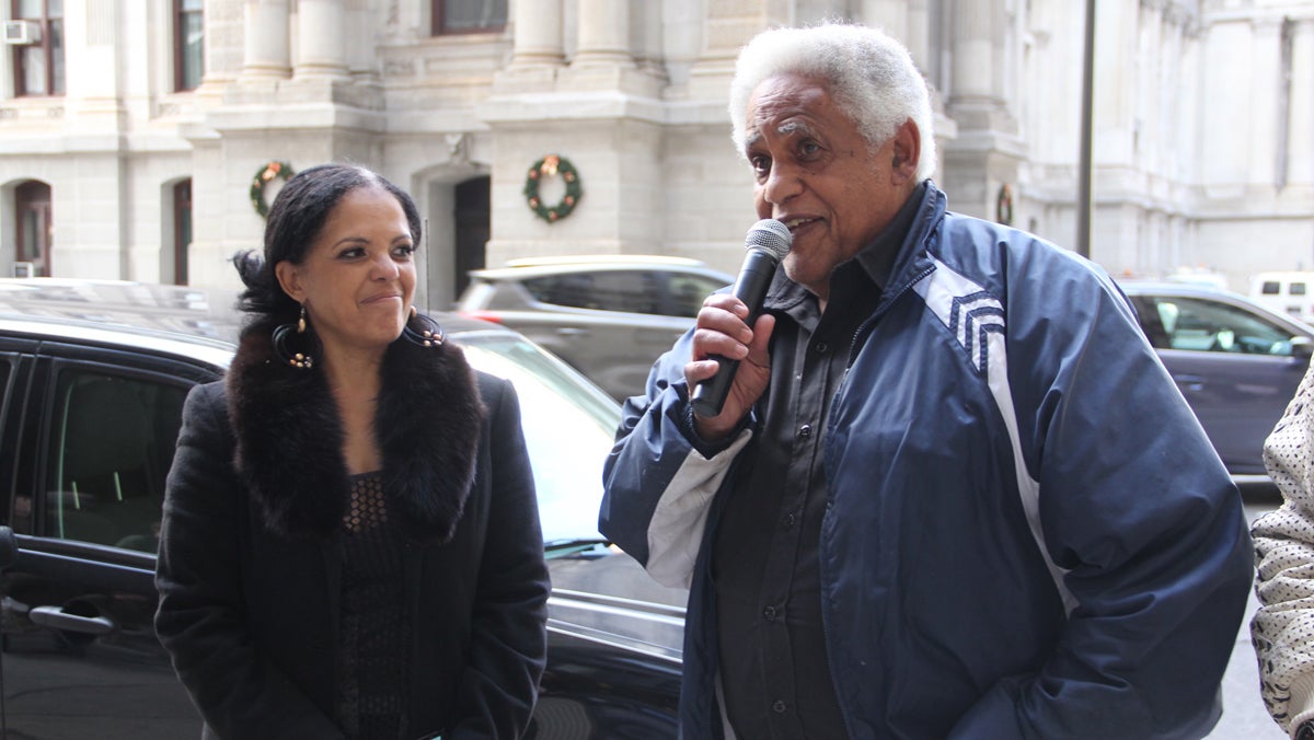  T. Milton Street and his daughter Renee Toppin speak outside the Philadelphia district attorney's office on matters related to 'Porngate.' (Emma Lee/WHYY)  