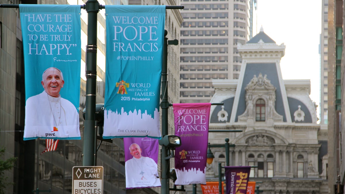  Banners on Market Street welcome Pope Francis to Philadelphia. (Emma Lee/WHYY) 