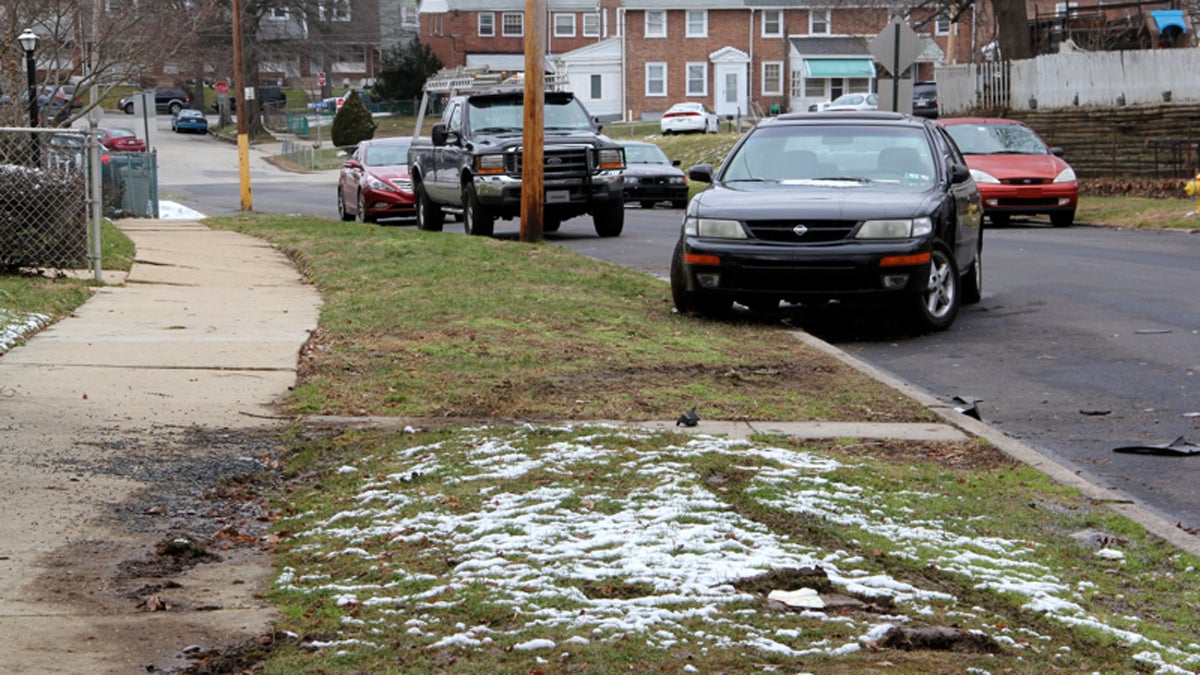  Shattered glass and car parts litter the scene of a fatal police shooting on Keystone Road in Chester. (Emma Lee/WHYY) 