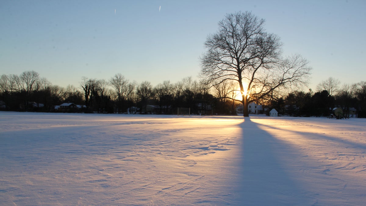 In this undated photo, the sun sets over an unbroken field of snow in Moorestown, New Jersey (Emma Lee/WHYY) 