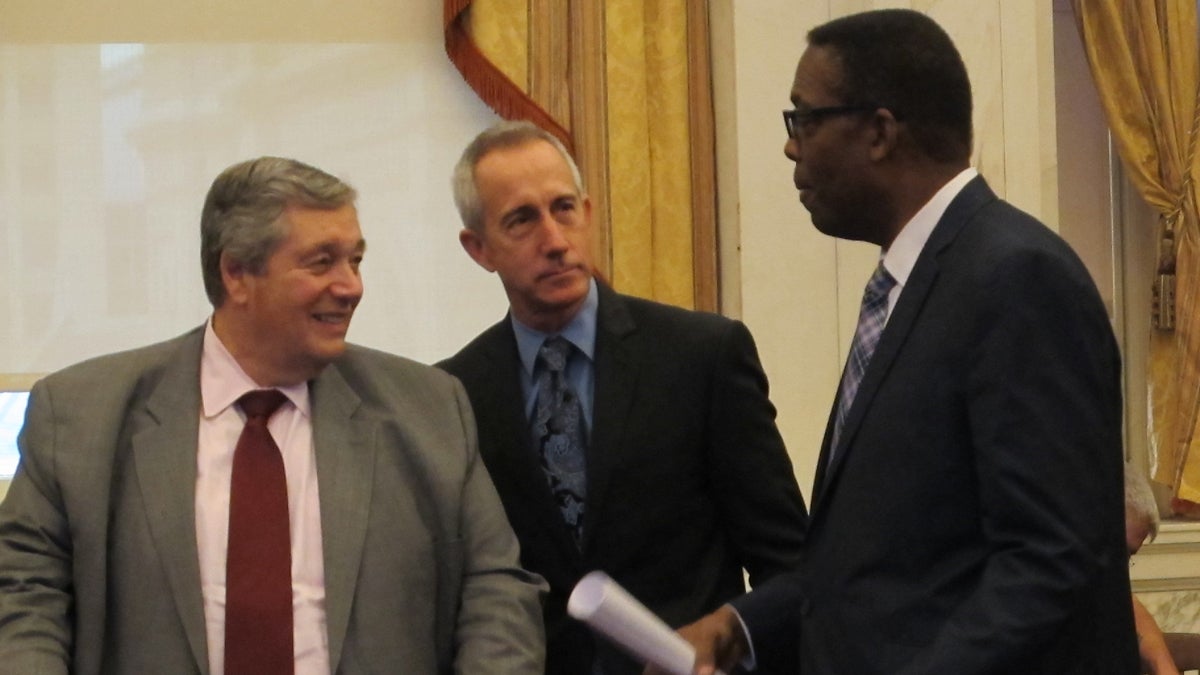  Philadelphia Energy Solutions CEO Phil Rinaldi, PGW CEO Craig White and City Council President Darrell Clarke share a moment before today’s hearings on the future of Philadelphia as an energy hub. (Katie Colaneri/WHYY) 