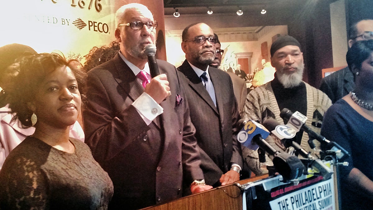  Bilal Qayyum, center, stands with organizers of the Philadelphia Black Political Summit at a press conference at the African American Museum in Philadelphia (Katie Colaneri/WHYY) 