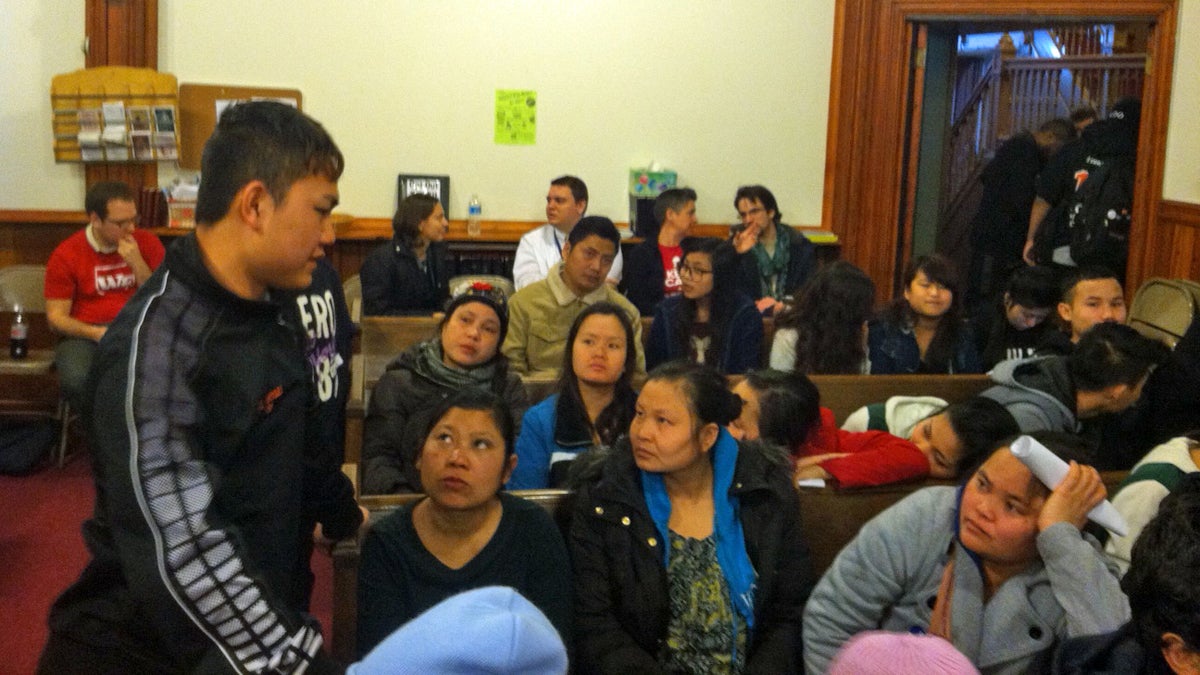  Furness High School student Lergay Htoo, translating information about opting out into Karen, a language spoken in Southeast Asia, at a community meeting earlier this year. (Laura Benshoff/WHYY) 