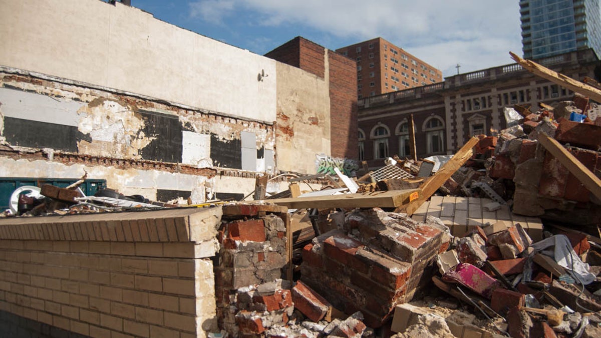  A piece of wall holds back some of the rubble from the 2013 collapse. (Lindsay Lazarski/WHYY) 