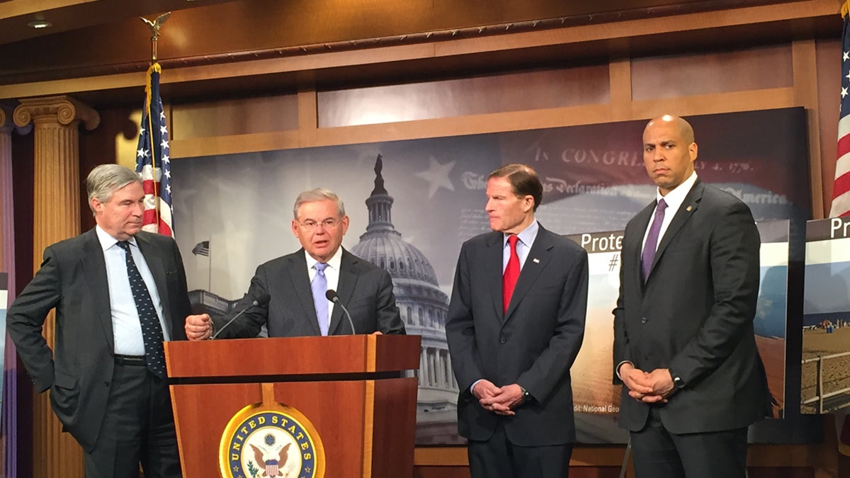  At the podium U.S. Sen. Bob Menendez, D-New Jersey proposes legislation to ban off-shore drilling in the Atlantic at a news conference with colleagues, including U.S. Sen. Cory Booker, D-New Jersey, right. (Matt Laslo/WHYY) 
