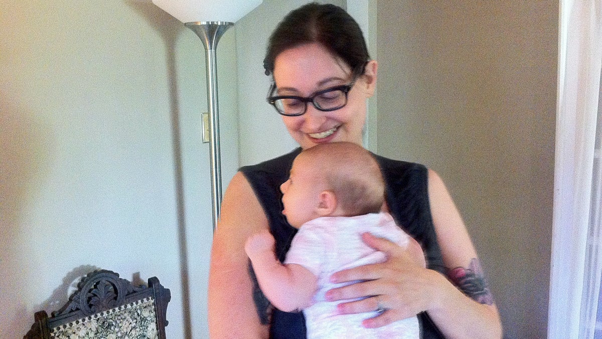  Erica Goldblatt Hyatt holds her newborn daughter. (Maiken Scott/WHYY) 