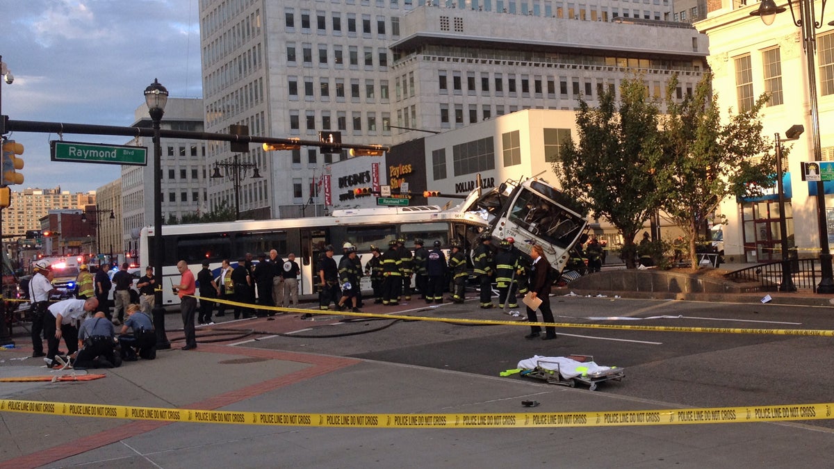 Emergency crews and police officers on the scene of a deadly commuter bus crash in Newark