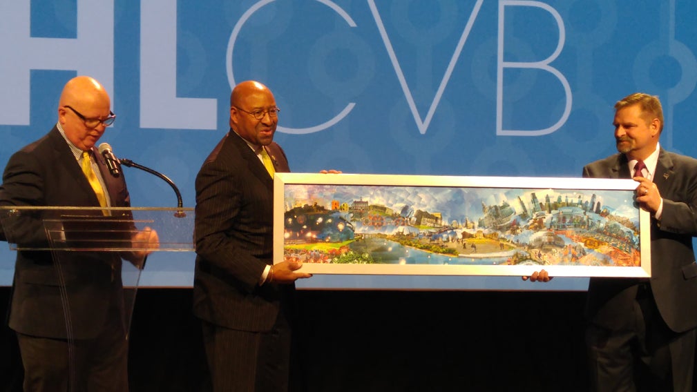  Mayor Michael Nutter, center, takes part in the announcement Wednesday that the The Biotechnology Industry Association has rebooked the Pennsylvania Convention Center for its 2019 convention. (Tom MacDonald/WHYY) 