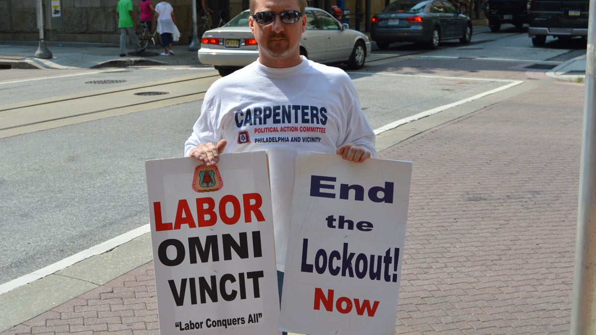  Carpenter Ron Curran protests outside the Pennsylvania Convention Center, Monday in Philadelphia (Tom MacDonald/WHYY) 