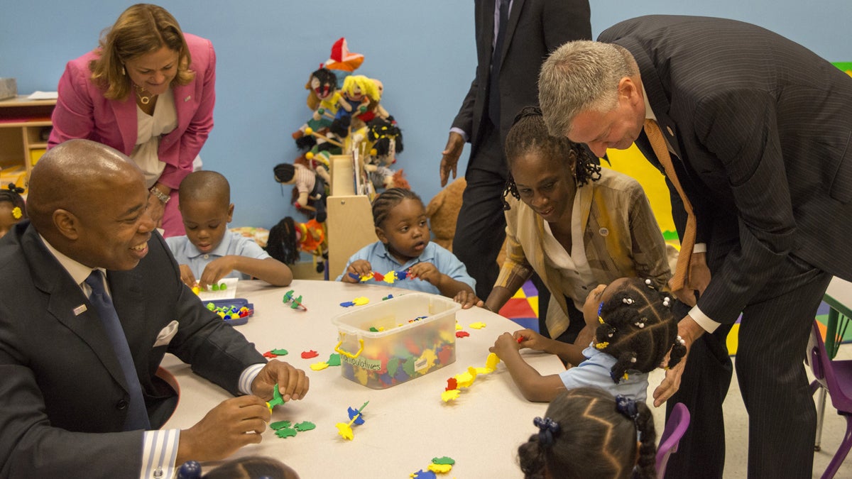  New York Mayor Bill de Blasio, right, visits with pre-kindergarten students at the Inner Force Tots early childhood learning center in Brooklyn. It is the first day of the mayor's ambitious expansion of early childhood education. (AP Photo/The Daily News, Theodore Parisienne, Pool) 