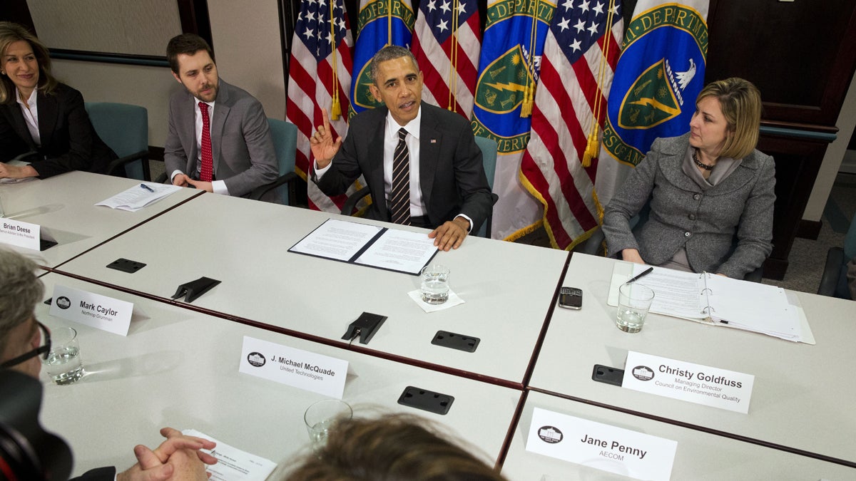  In this March 19, 2015, file photo, President Barack Obama, flanked by senior adviser Brian Deese, left, and Christina Goldfuss, managing director of the Council on Environmental Quality, speaks at Energy Department in Washington. The president pledged to cut United States greenhouse gas emissions by up to 28 percent. (AP Photo/Jacquelyn Martin) 