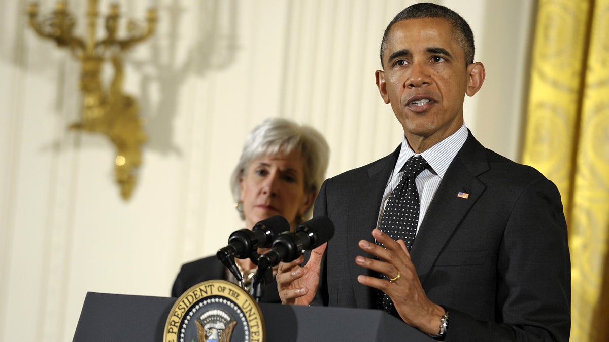  President Barack Obama, standing next to Health and Human Services Secretary Kathleen Sebelius, speaks at the opening of the National Conference on Mental Health. (AP Photo/Susan Walsh, file) 