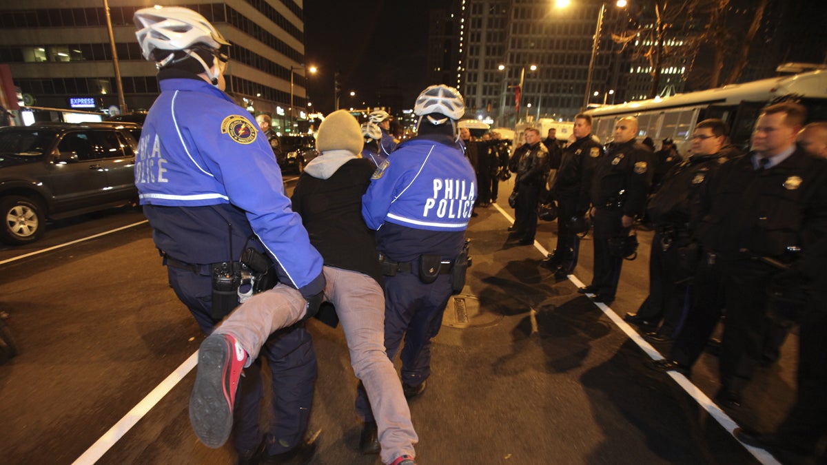  Police are shown arresting a member of Occupy Philly on Nov. 30, 2011, in Philadelphia, after a small group refused to clear a street while police cleared the encampment at Dilworth Plaza. (AP Photo/ Joseph Kaczmarek) 
