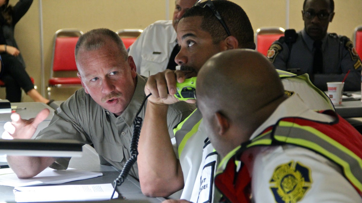 Philadelphia's first responders react to a simulated oil train derailment during an exercise at the Philadelphia Fire Academy. (Emma Lee/WHYY)